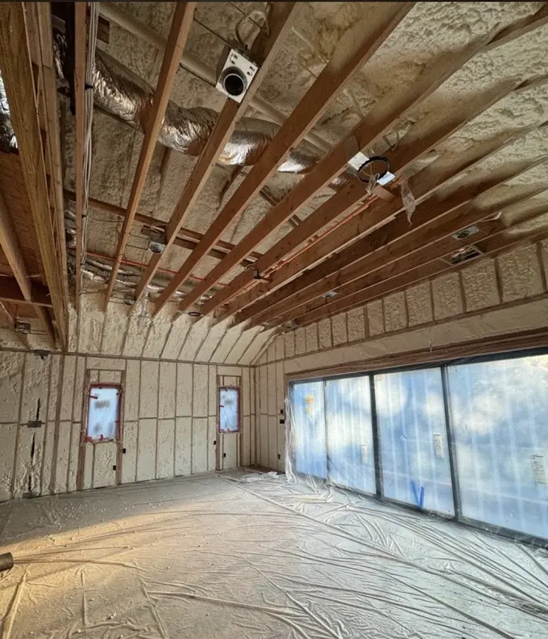 Interior walls and ceiling insulated with spray foam during new construction in Lenexa